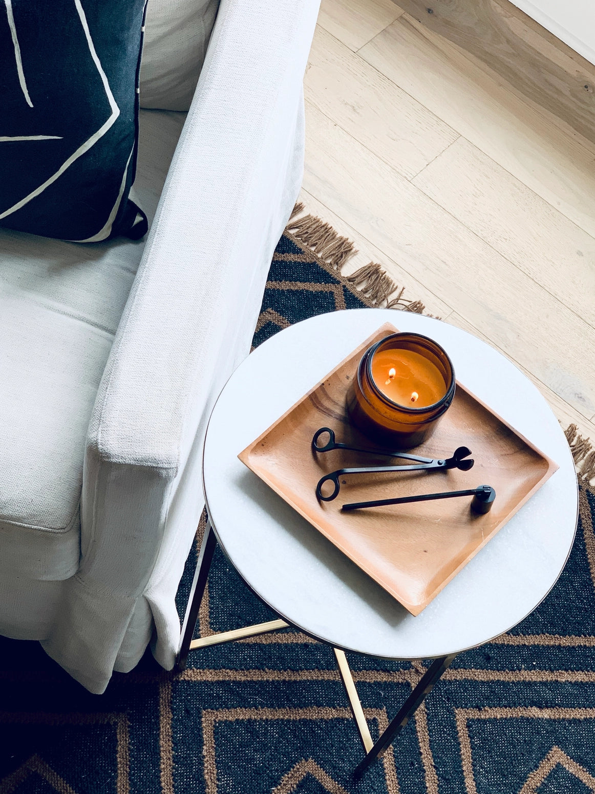 Candle Care Kit, including a wick trimmer, snuffer, and matches, enclosed in a hand lettered bag. Designed to help maintain candle longevity and ensure a clean, even burn every time.