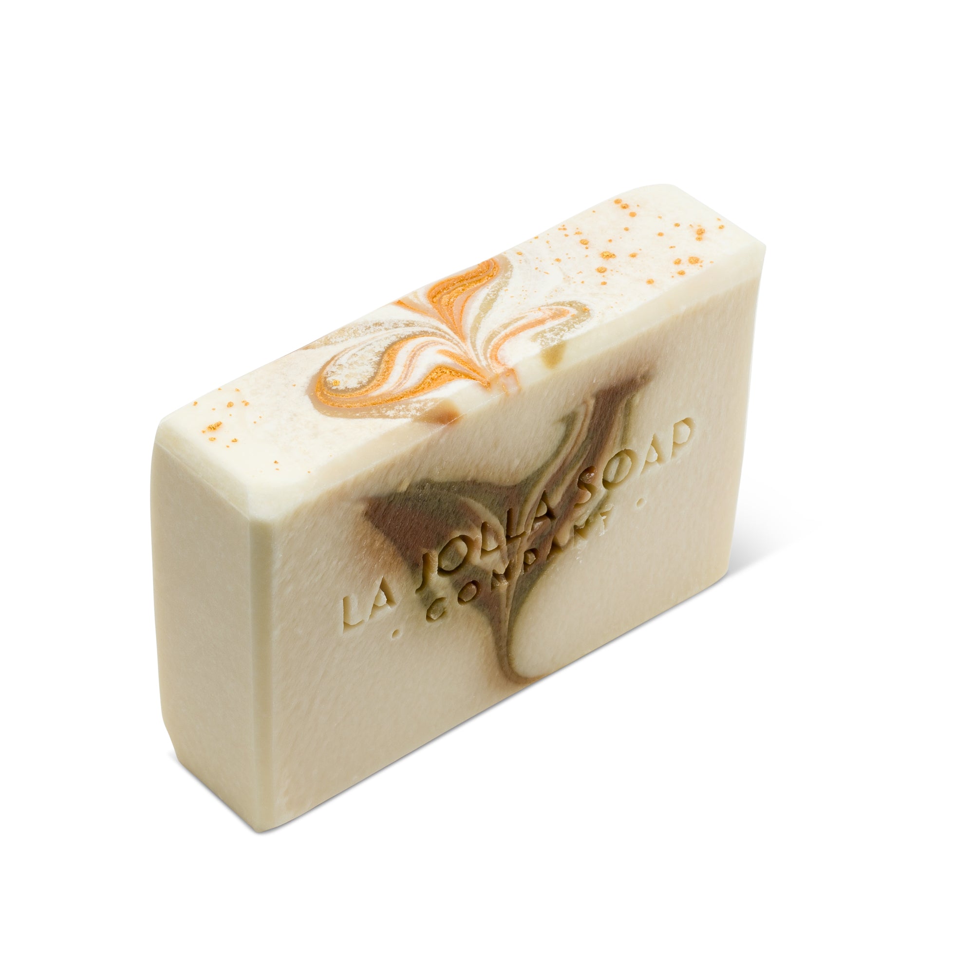 The top view of a Sea Salt soap bar White in color with brown and green swirls on the front of the bar that is shaped like a heart. La Jolla Soap Company
