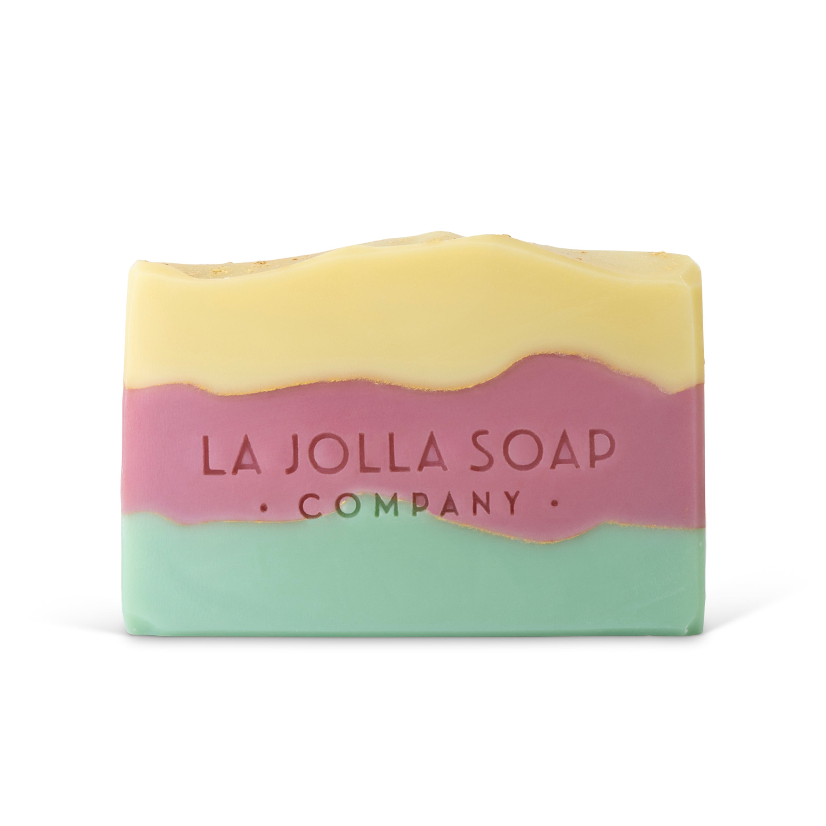 Three-layered soap bar with 'La Jolla Soap Company' branding on a white background