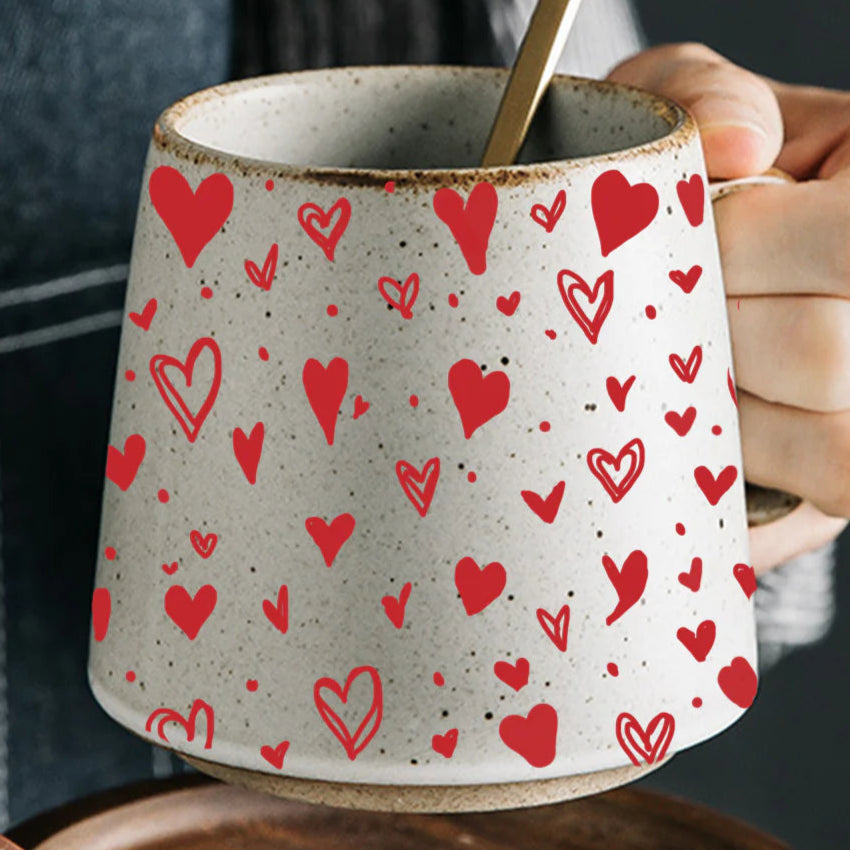 Artisan Mug, handcrafted stoneware with red colored painted hearts, included is a wood coaster.