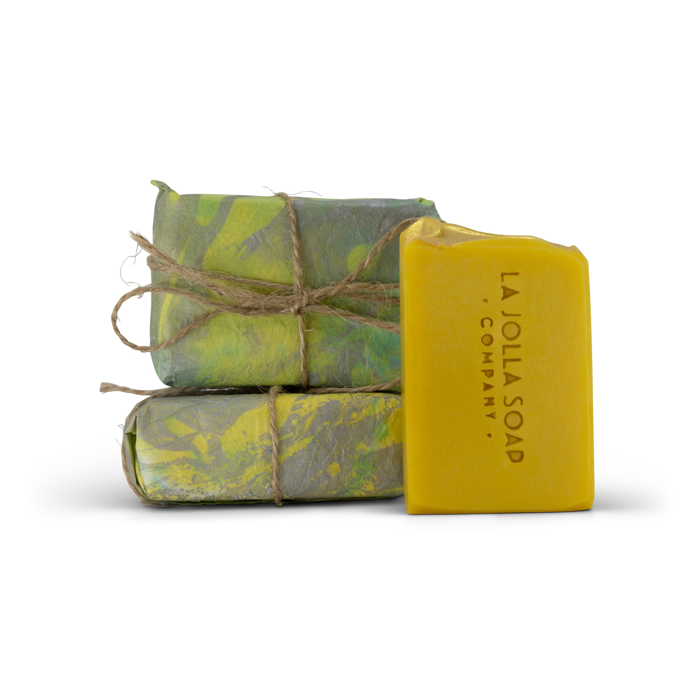 Two wrapped bars of soap and one unwrapped bar of soap with 'La Jolla Soap Company' branding on a clean white background.