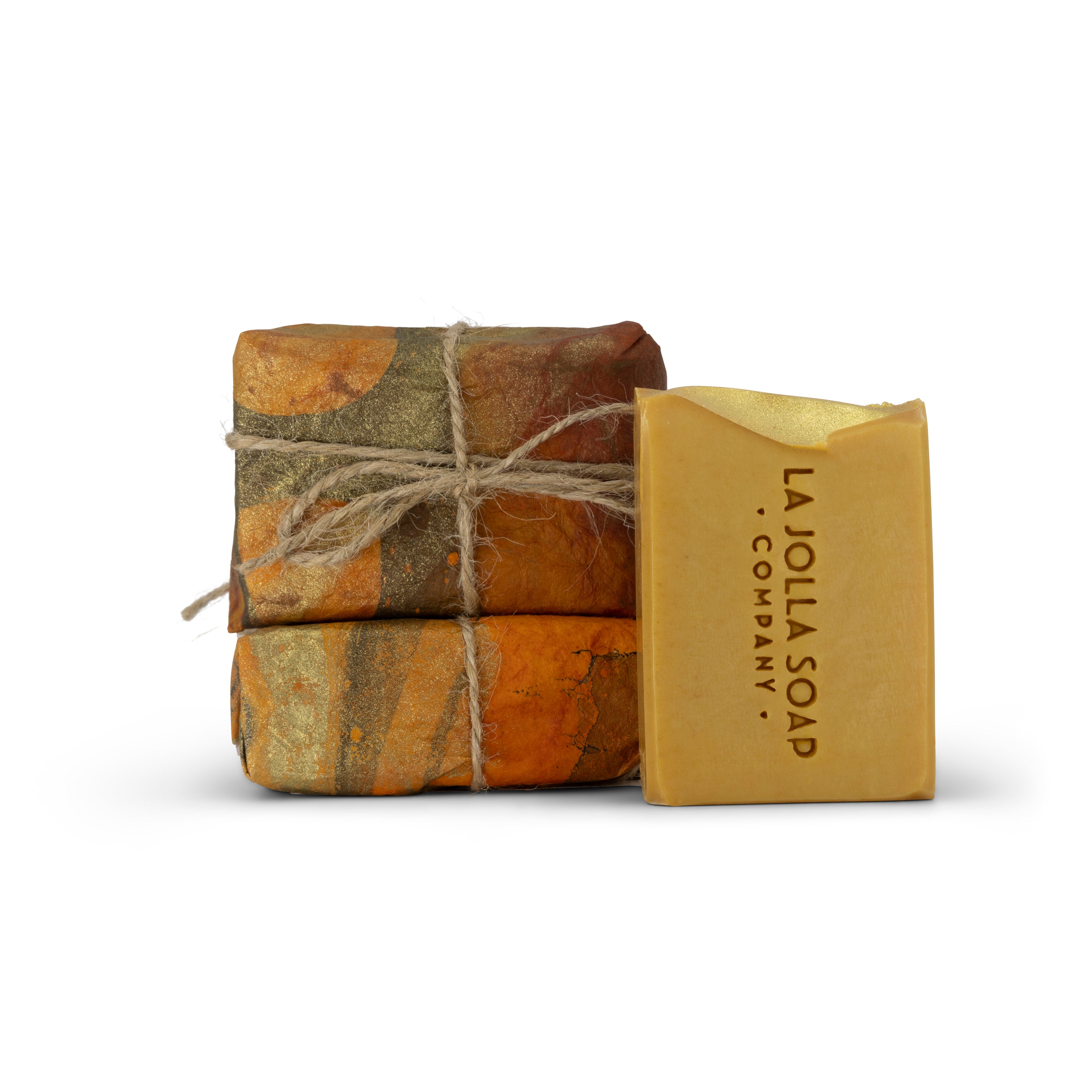 Two stacked soap bars with a third one leaning against them, all from La Jolla Soap Company.