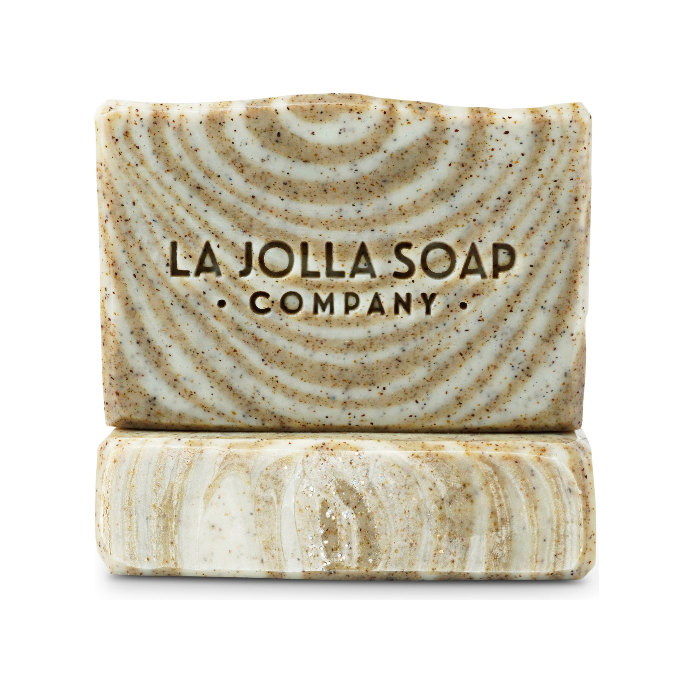 Two swirled soap bars from La Jolla Soap Company on a white background